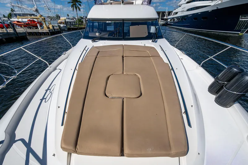 Slide: The Image of 2012 Prestige Flybridge yacht with sunbathing deck, docked at marina. - 69