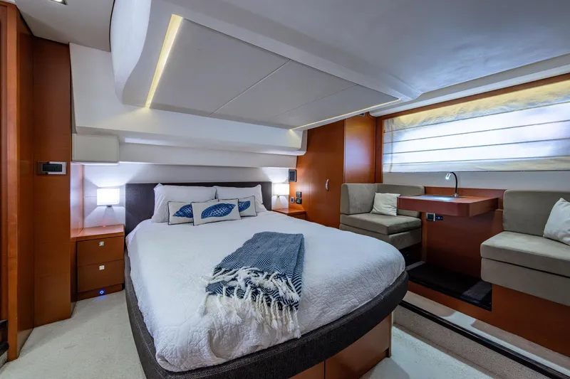 Slide: The Image of Luxurious bedroom interior of 2012 Prestige Flybridge yacht with modern design and cozy seating area. - 83