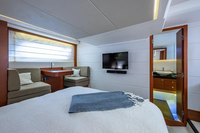 Slide: The Image of Luxurious 2012 Prestige Flybridge yacht bedroom with modern decor and ensuite bathroom. - 85