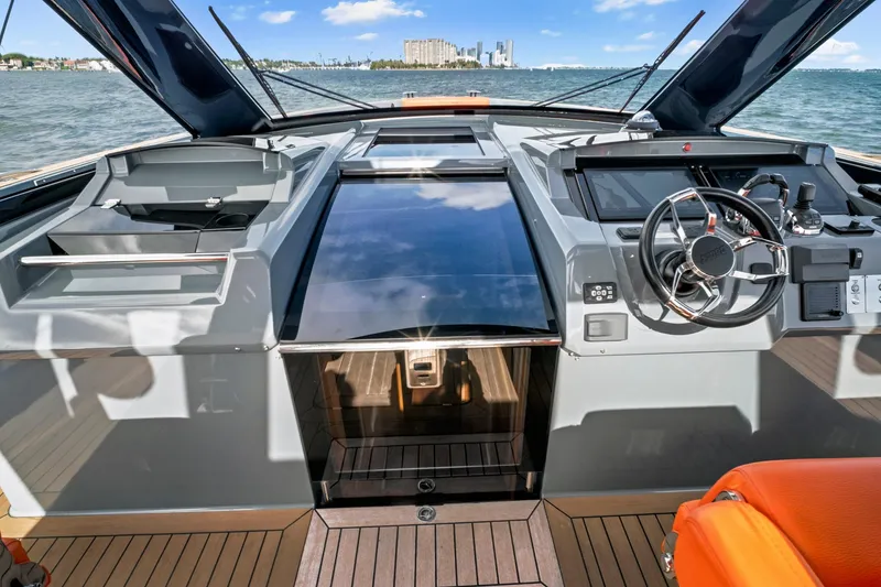 Slide: The Image of Cockpit of 2019 Fjord 52 Open yacht with modern controls and ocean view. - 15