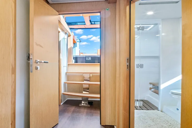Slide: The Image of Interior view of 2019 Fjord 52 Open yacht, featuring wooden doors and modern design. - 18