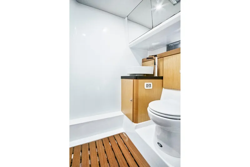 Slide: The Image of Modern bathroom interior on 2019 Fjord 52 Open yacht with wooden accents and sleek fixtures. - 24