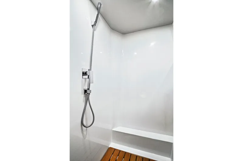 Slide: The Image of Modern shower area in 2019 Fjord 52 Open yacht with sleek fixtures and wooden flooring. - 25