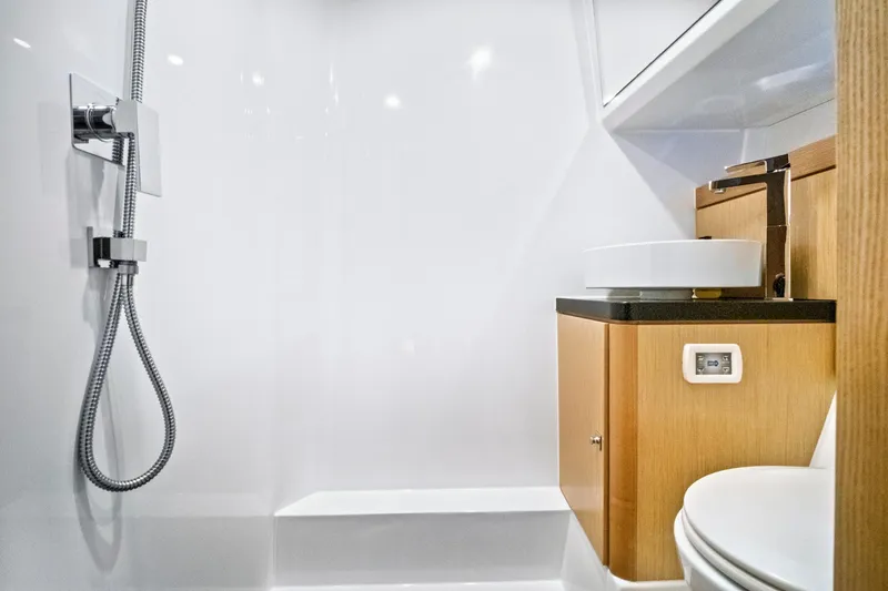 Slide: The Image of Modern bathroom interior of 2019 Fjord 52 Open yacht with shower and wooden cabinetry. - 26