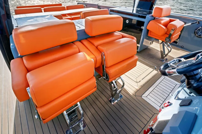 Slide: The Image of Luxurious 2019 Fjord 52 Open yacht interior with vibrant orange seating and sleek design. - 7