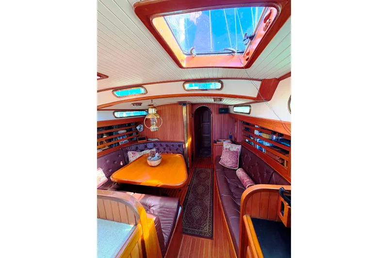 Slide: The Image of Luxurious interior of 1987 Hans Christian Cristina 40 sailboat with wood finish and skylight. - 11