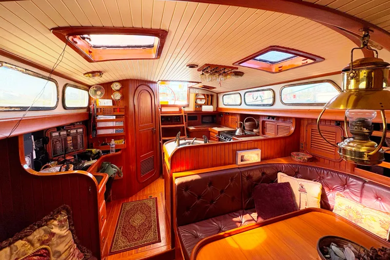 Slide: The Image of Luxurious 1987 Hans Christian Cristina 40 yacht interior with wood paneling and elegant furnishings. - 13