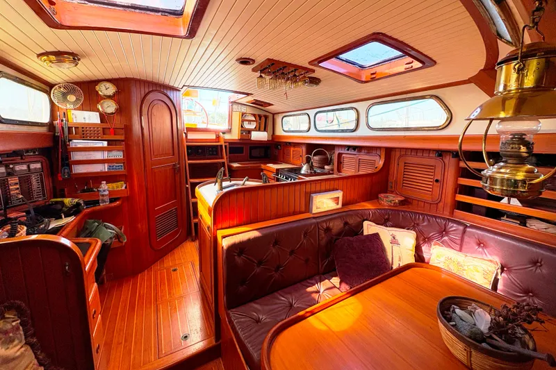 Slide: The Image of Luxurious 1987 Hans Christian Cristina 40 yacht interior with wood finish and cozy seating area. - 14