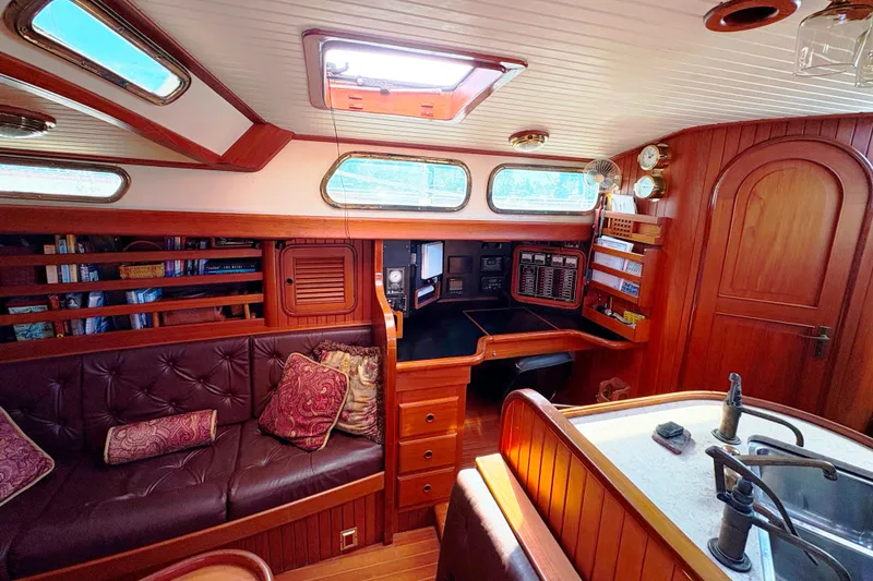 Slide: The Image of Interior of 1987 Hans Christian Cristina 40 yacht with wood paneling and plush seating. - 15