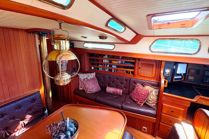 Slide: The Image of Interior of 1987 Hans Christian Cristina 40 sailboat with wood paneling and plush seating. - 16