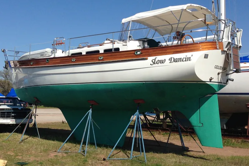 Slide: The Image of 1987 Hans Christian Cristina 40 sailboat on stands, named "Slow Dancin'," with green hull. - 3