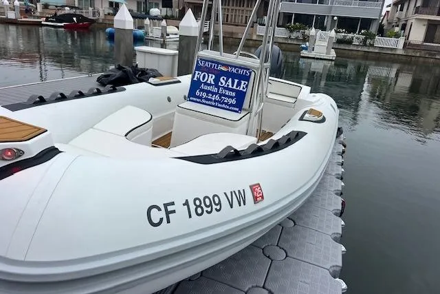 Slide: The Image of 2023 Novurania Como 18 boat for sale at dock, contact details visible. - 12