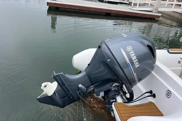 Slide: The Image of Novurania Como 18 boat with Yamaha outboard motor docked in calm waters, 2023 model. - 5