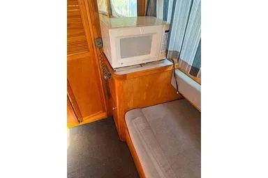 Slide: The Image of Interior of 2001 Logan 33 with microwave and seating area. - 24