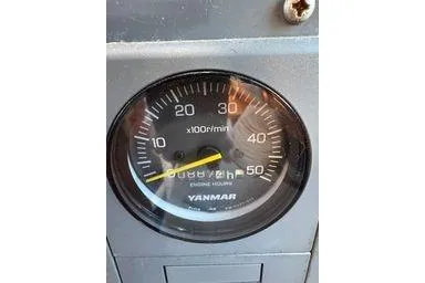 Slide: The Image of Close-up of a Yanmar tachometer on a 2001 Logan 33 model. - 28