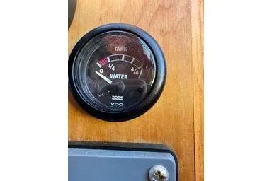 Slide: The Image of Water tank gauge on Logan 33, 2001 model, showing levels on wooden panel. - 31