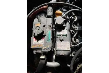 Slide: The Image of Close-up of a 2001 Logan 33 engine with visible components and labels. - 34