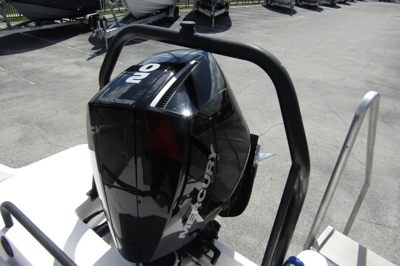 Slide: The Image of 2022 Axopar AX22TT boat with Mercury outboard engine in a parking lot. - 19