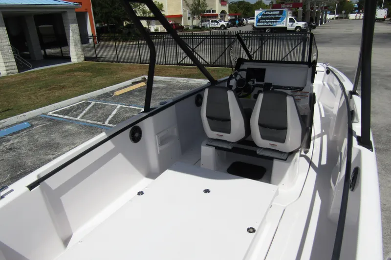 Slide: The Image of 2022 Axopar AX22TT boat interior with dual seats and steering console. - 20