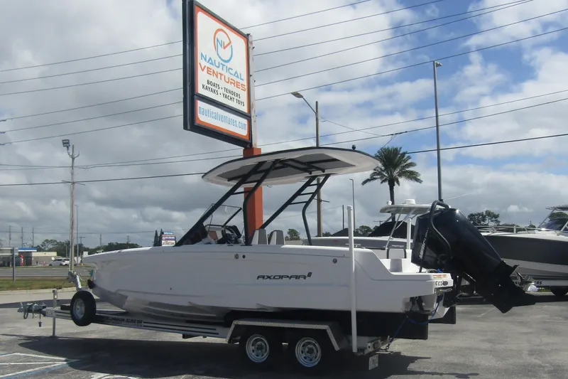 Slide: The Image of 2022 Axopar AX22TT boat on trailer at Nautical Ventures dealership. - 3