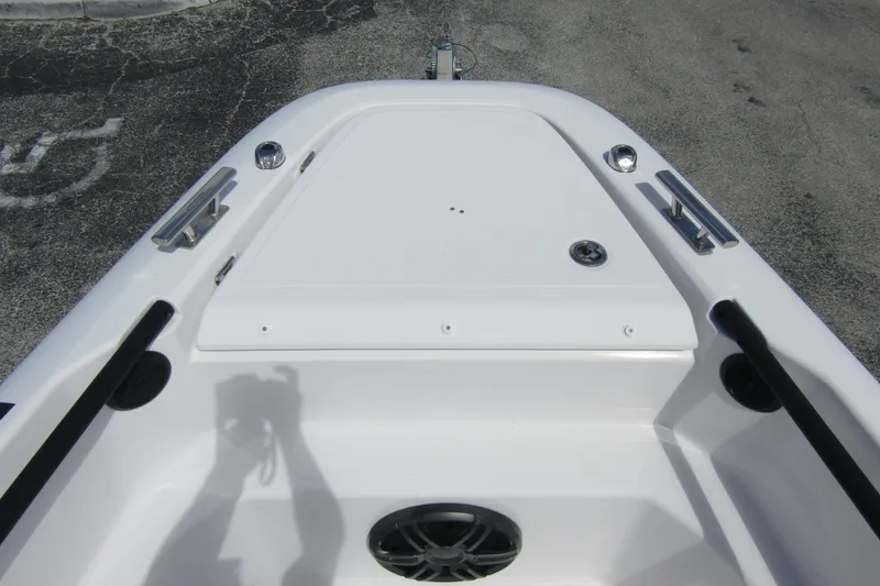 Slide: The Image of 2022 Axopar AX22TT boat deck with cleats and storage compartment. - 6
