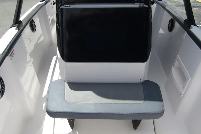Slide: The Image of 2022 Axopar AX22TT boat interior with seating and storage compartment. - 9