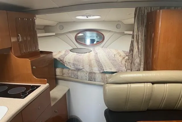 Slide: The Image of Interior of 2000 Four Winns 328 Vista boat with cozy cabin and kitchenette. - 12
