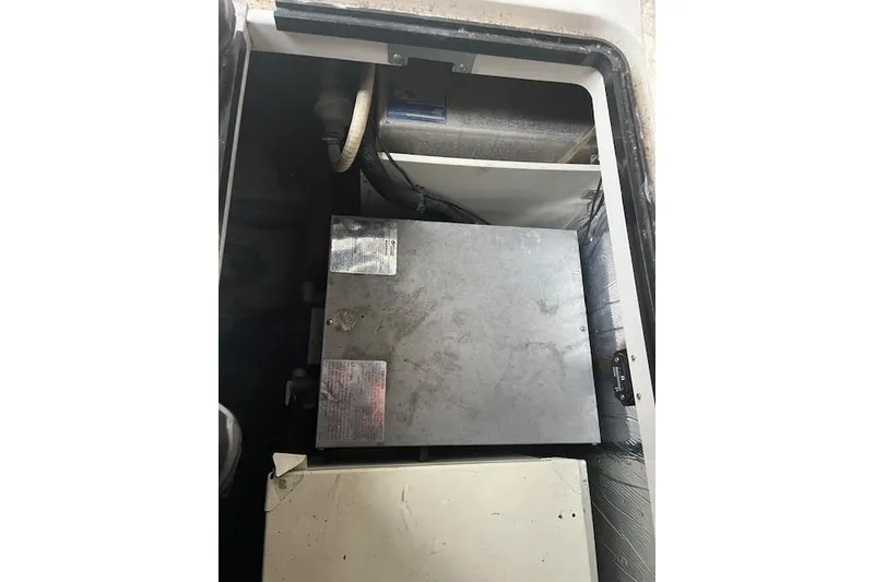 Slide: The Image of 2000 Four Winns 328 Vista engine compartment with metal components and wiring. - 20