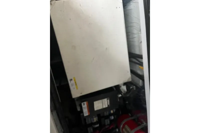 Slide: The Image of Engine compartment of a 2000 Four Winns 328 Vista boat, showing mechanical components. - 21