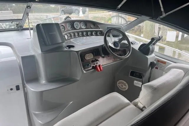 Slide: The Image of Cockpit of 2000 Four Winns 328 Vista boat with steering wheel and control panel. - 6