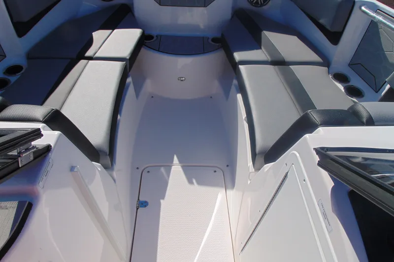 Slide: The Image of Interior of 2026 Yamaha Boats 222XD, featuring sleek steering and modern dashboard design. - 13