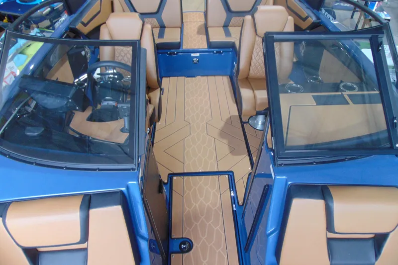 Slide: The Image of 2026 Yamaha Boats 222XD interior with tan seats and modern dashboard design. - 21
