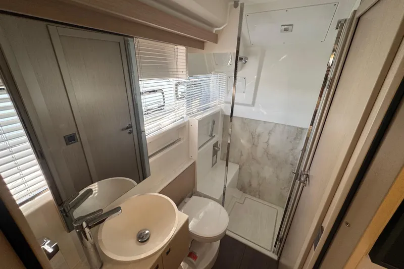 Slide: The Image of 2024 Jeanneau DB43 yacht bathroom with modern fixtures and glass shower enclosure. - 29