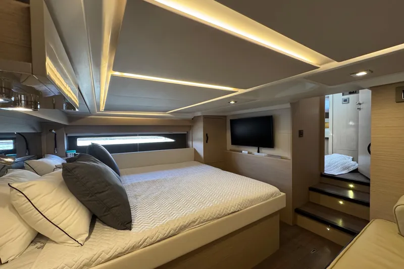 Slide: The Image of Luxurious interior of 2024 Jeanneau DB43 yacht with modern bedroom and ambient lighting. - 30