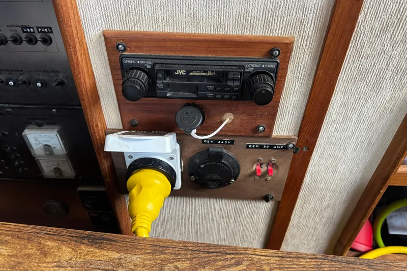 Slide: The Image of Control panel of a 1985 Carver 3607 Aft Cabin Motor Yacht with radio and power connections. - 43