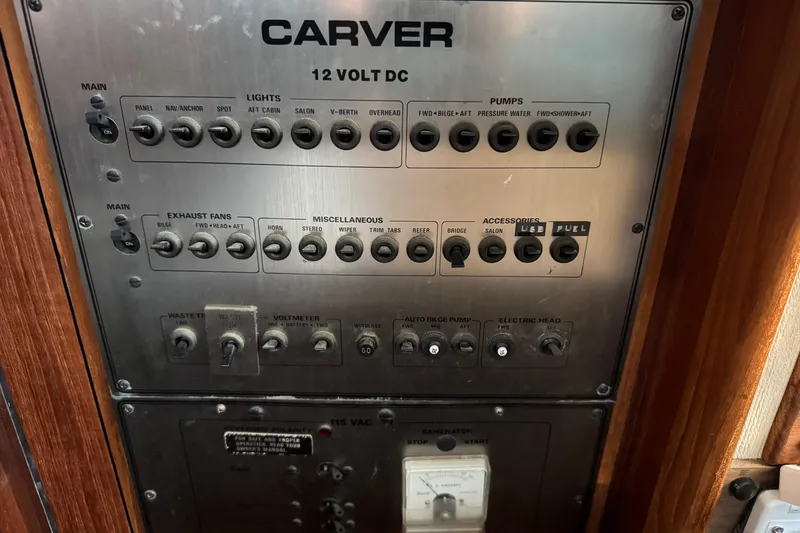 Slide: The Image of Control panel of 1985 Carver 3607 Aft Cabin Motor Yacht with switches and labels. - 44