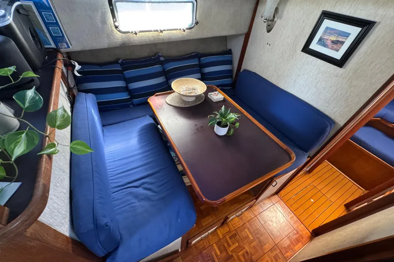 Slide: The Image of Interior of 1985 Carver 3607 Aft Cabin Motor Yacht with cozy dining area. - 51