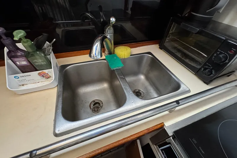 Slide: The Image of Kitchen sink area in 1985 Carver 3607 Aft Cabin Motor Yacht with toaster oven. - 57