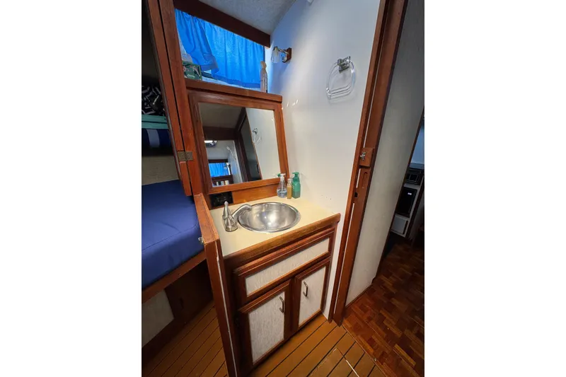 Slide: The Image of 1985 Carver 3607 Aft Cabin Motor Yacht interior with sink and mirror. - 64