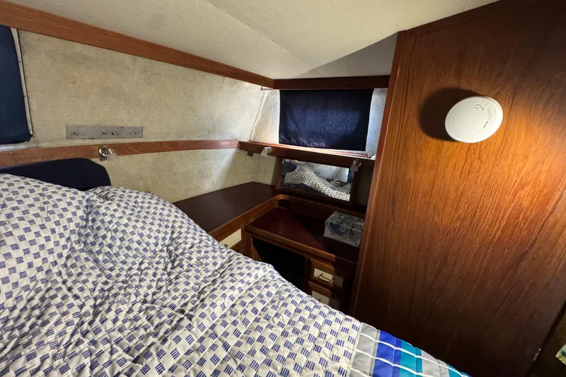 Slide: The Image of Interior cabin of 1985 Carver 3607 Aft Cabin Motor Yacht with bed and wooden furnishings. - 72