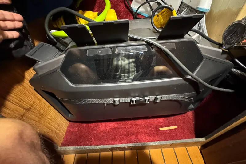 Slide: The Image of 1985 Carver 3607 Aft Cabin Motor Yacht interior with electronic equipment and cables. - 77