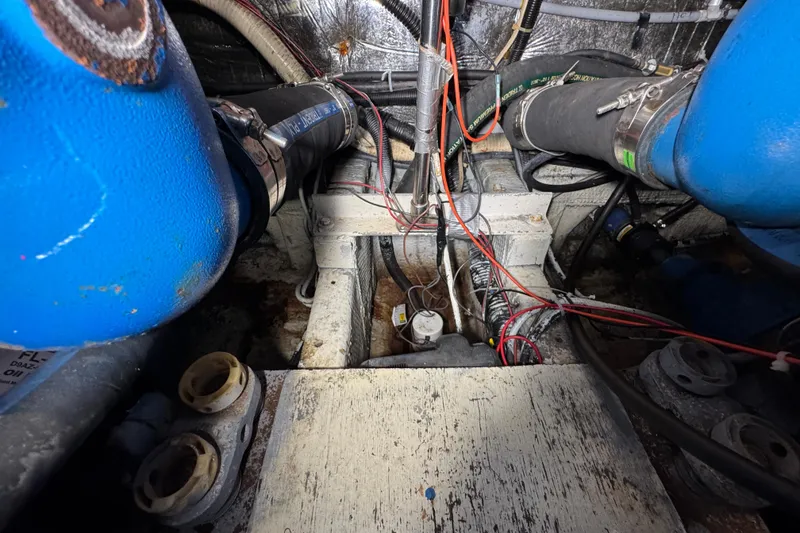 Slide: The Image of Engine room of 1985 Carver 3607 Aft Cabin Motor Yacht with visible wiring and components. - 82