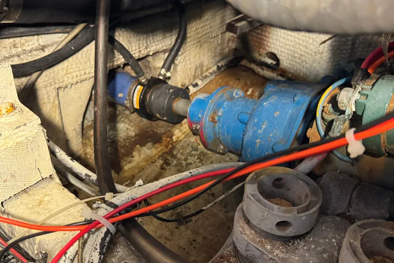 Slide: The Image of Engine compartment of a 1985 Carver 3607 Aft Cabin Motor Yacht, showing wiring and components. - 84