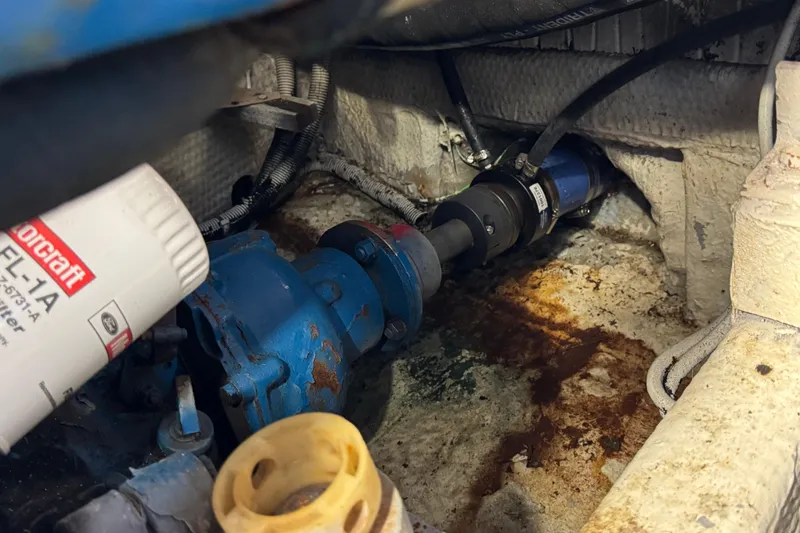 Slide: The Image of Engine compartment of 1985 Carver 3607 Aft Cabin Motor Yacht showing mechanical components. - 85