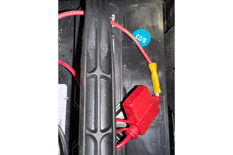 Slide: The Image of Battery wiring in a 1985 Carver 3607 Aft Cabin Motor Yacht, featuring red and yellow connectors. - 89