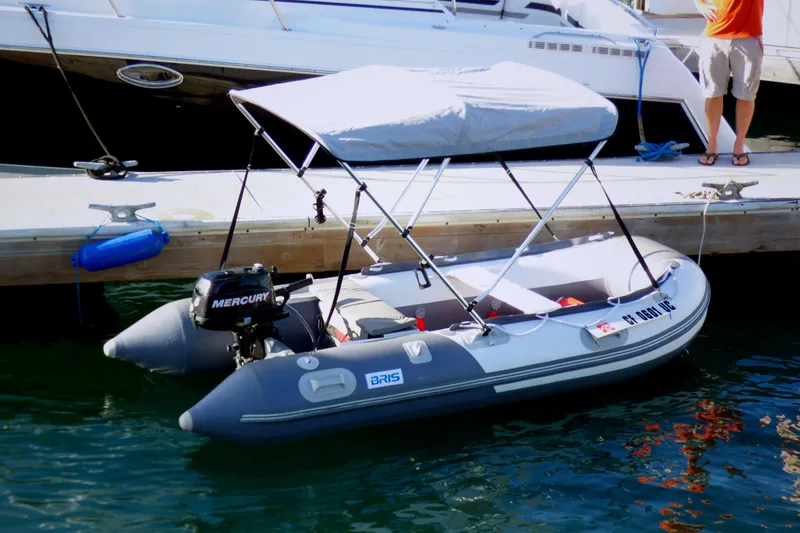 Slide: The Image of Inflatable boat with Mercury motor docked beside Carver 3607 Aft Cabin Motor Yacht. - 9
