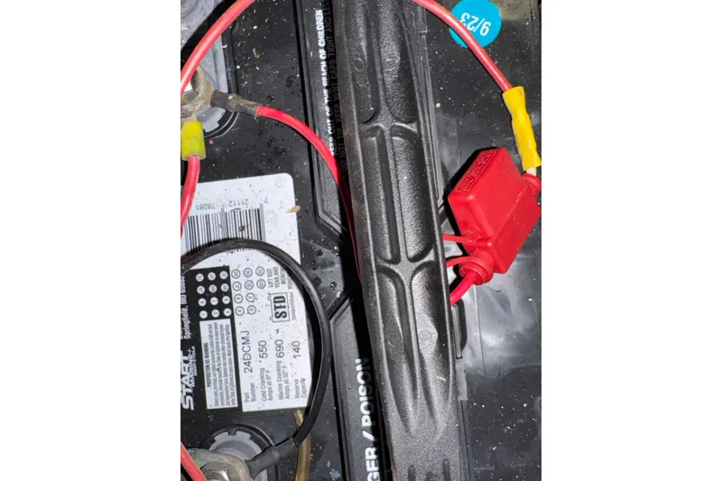 Slide: The Image of Battery setup in 1985 Carver 3607 Aft Cabin Motor Yacht with red and black cables. - 90