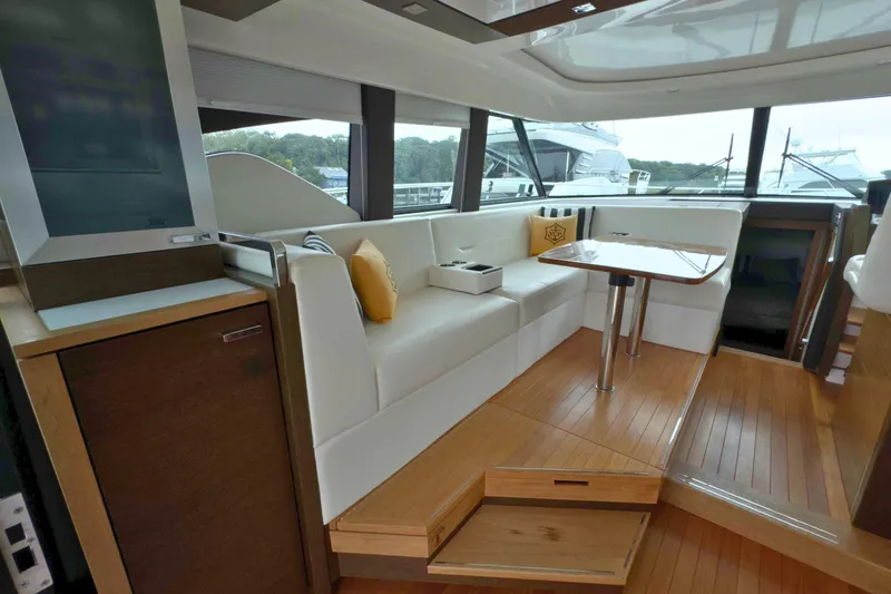 Slide: The Image of Luxurious interior of 2018 Tiara Yachts C44 Coupe with elegant seating and wooden flooring. - 22