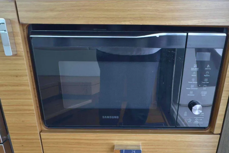 Slide: The Image of Built-in Samsung microwave in 2018 Tiara Yachts C44 Coupe kitchen. - 25