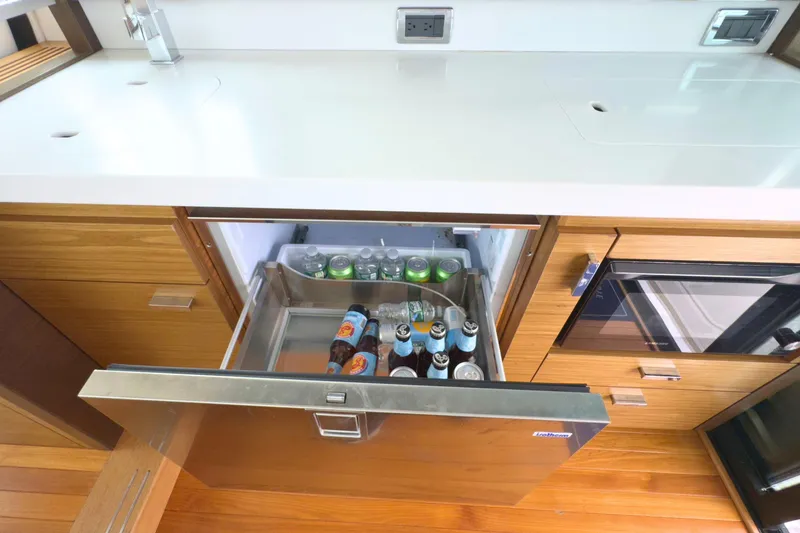 Slide: The Image of Luxury yacht kitchen with open beverage drawer, Tiara Yachts C44 Coupe 2018. - 27